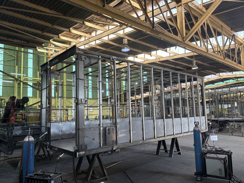 A truck body under construction in a client's workshop