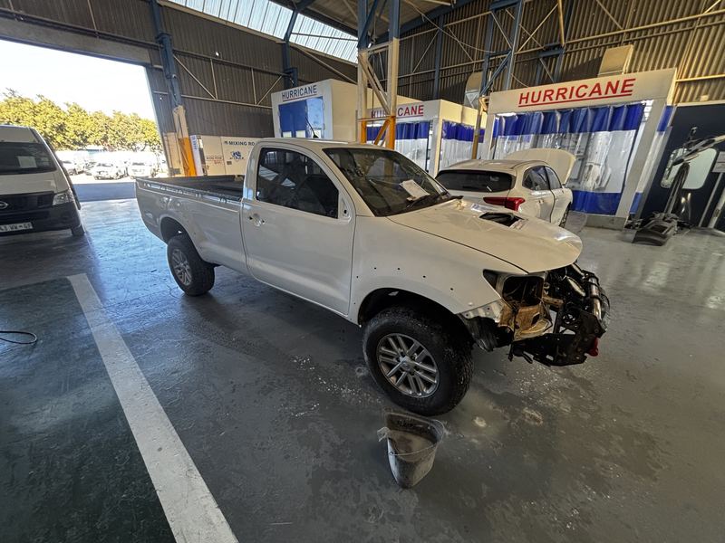 A bakkie under repair in a workshop bay